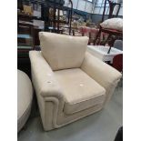 Contemporary armchair in pale cream