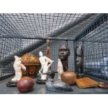 Cage of tribal carved figures, resin okimonos, etc.