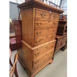 George III style oak chest on chest with an arrangement of eight drawers and a slide on bracket feet