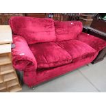 Velveteen two seater sofa on castors