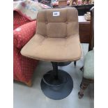 Tan button upholstered bar stool