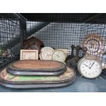 Cage of assorted clocks and clock plinths