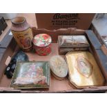 Box of tins and an Art Deco style wall plaque