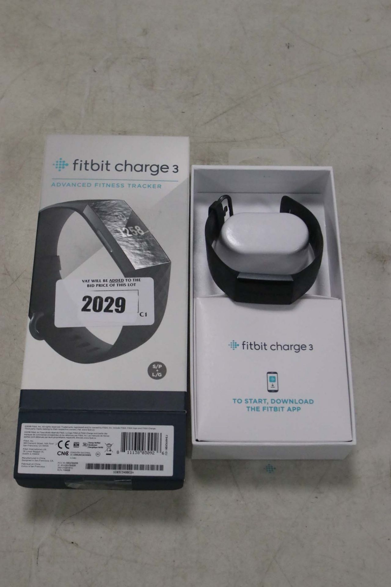 FitBit Charge 3 fitness tracker in box