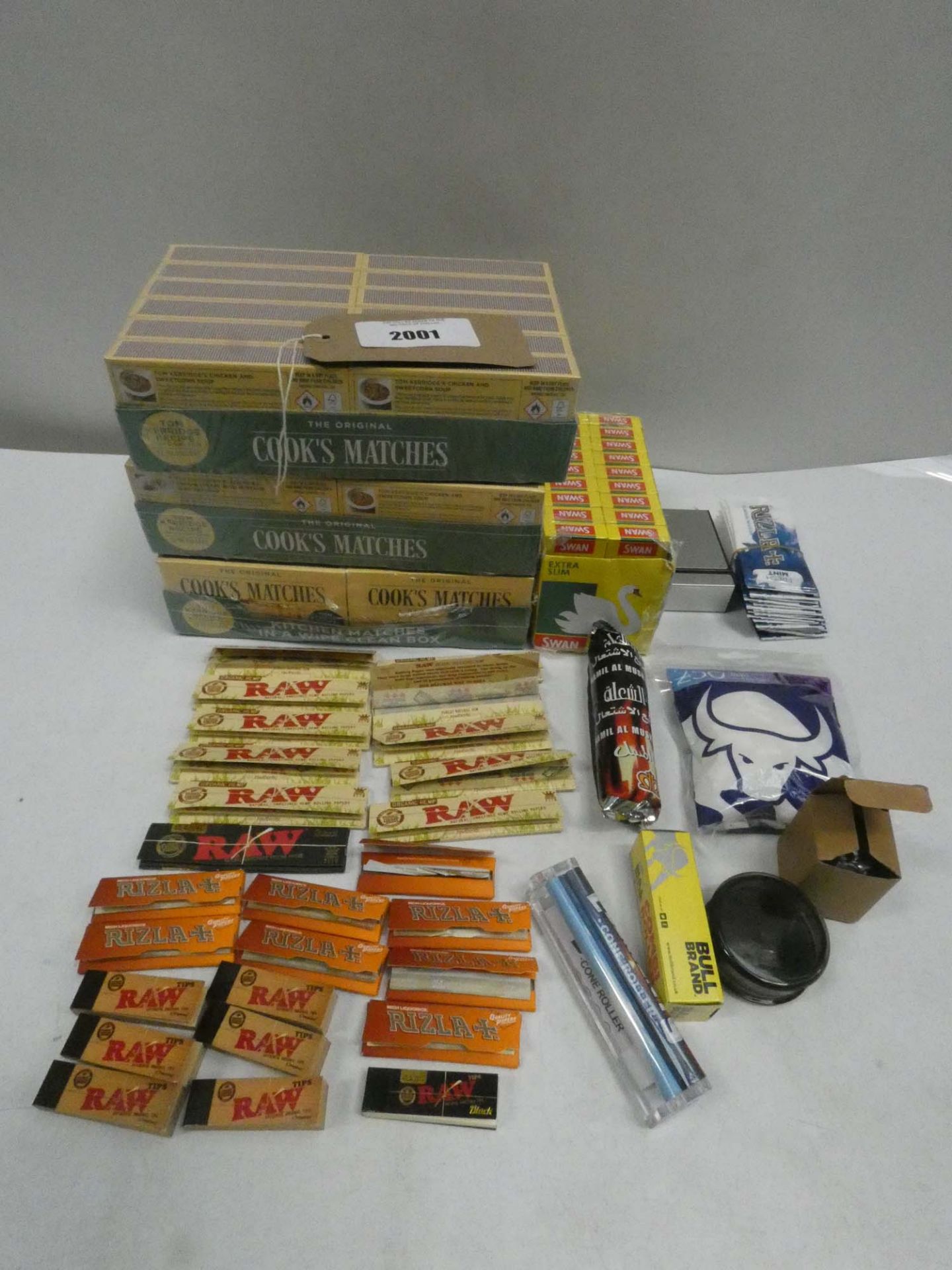 Quantity of cigarette papers, filters and matches