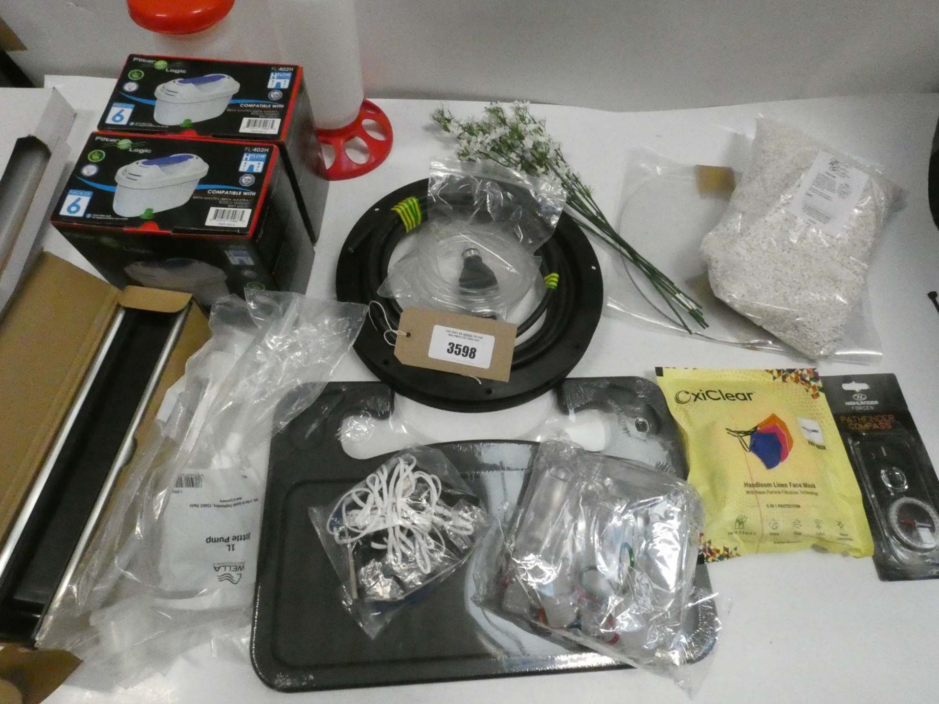 Bag containing filters, masks, letter box, perlite, compasss, faux flowers, etc