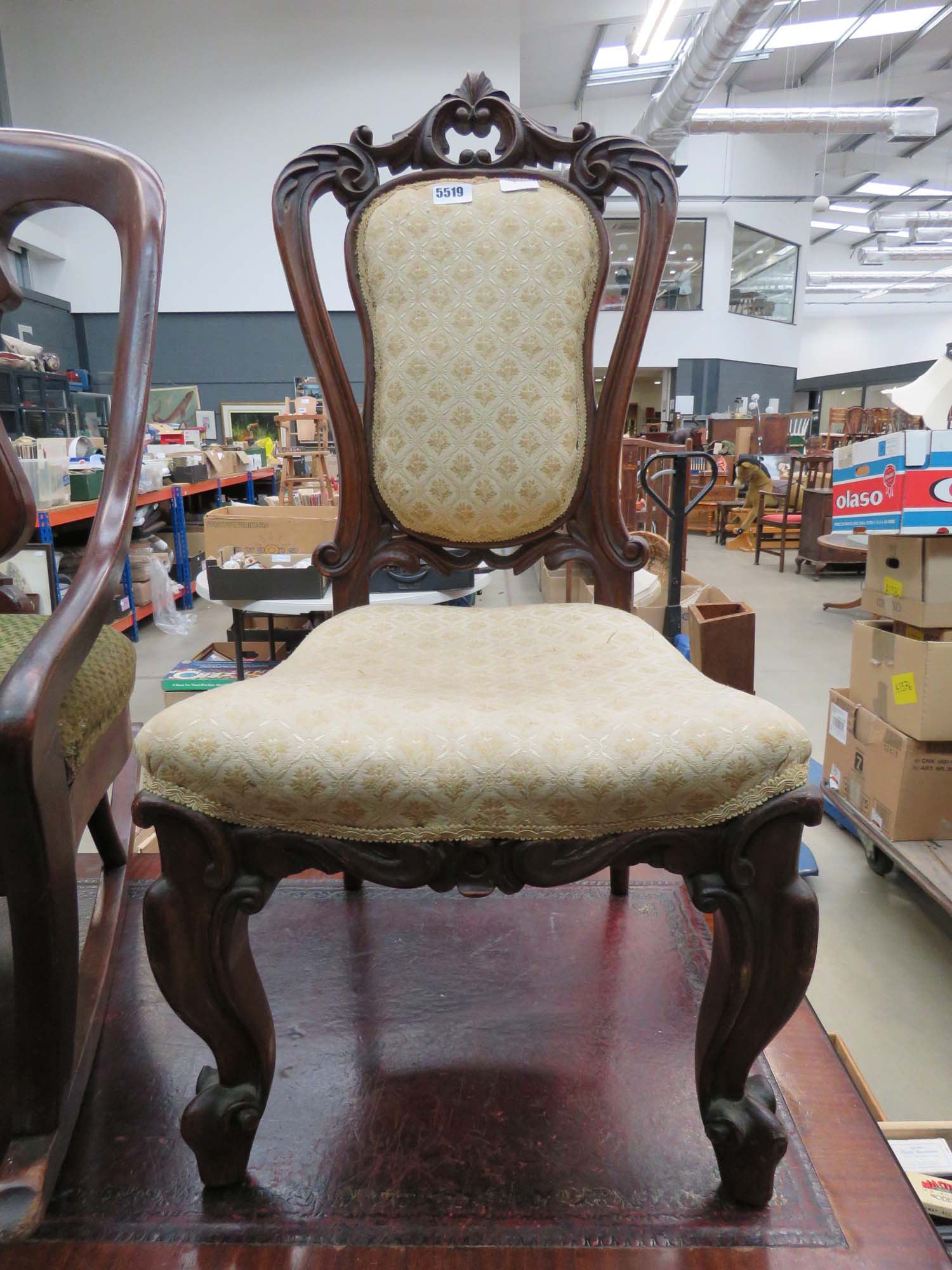 Carved wooden Edwardian chair with upholstered seat and backrest