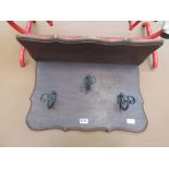 Stained beech hanging shelf with 3 wrought iron coat hooks under