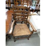 Ladderback rush seated carver chair