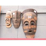 3 carved African masks