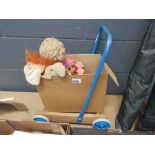 Child's push along barrow with wooden play bricks and box with troll and Cabbage Patch figures