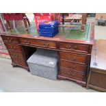 Reproduction mahogany and green tooled leather twin pedestal desk