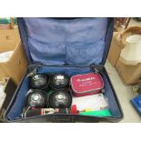 Vintage suitcase with quantity of lawn bowls