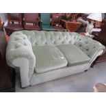 Green button upholstered Chesterfield style sofa