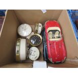 Box containing alarm clocks and 2 toy cars