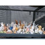 Cage containing large quantity of ornamental bunny rabbits