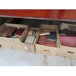 4 boxes containing military and other reference books