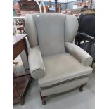 Grey wingback armchair