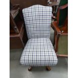 Checked swivel chair with a pine base