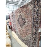 (20) Louis de Poortere carpet with a salmon ground and central medallion