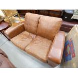 Tan leather effect 2 seater sofa with matching footstool