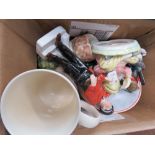 Box containing ornamental animal figures, plates, and coffee mug