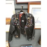 Motorcycle leather jacket with badges Triumph Cambs and tiger head painted on back. Stars and