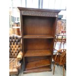Pair of oak open fronted adjustable bookcases with connecting bracket