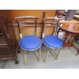 Pair of chromed and blue seated dining chairs