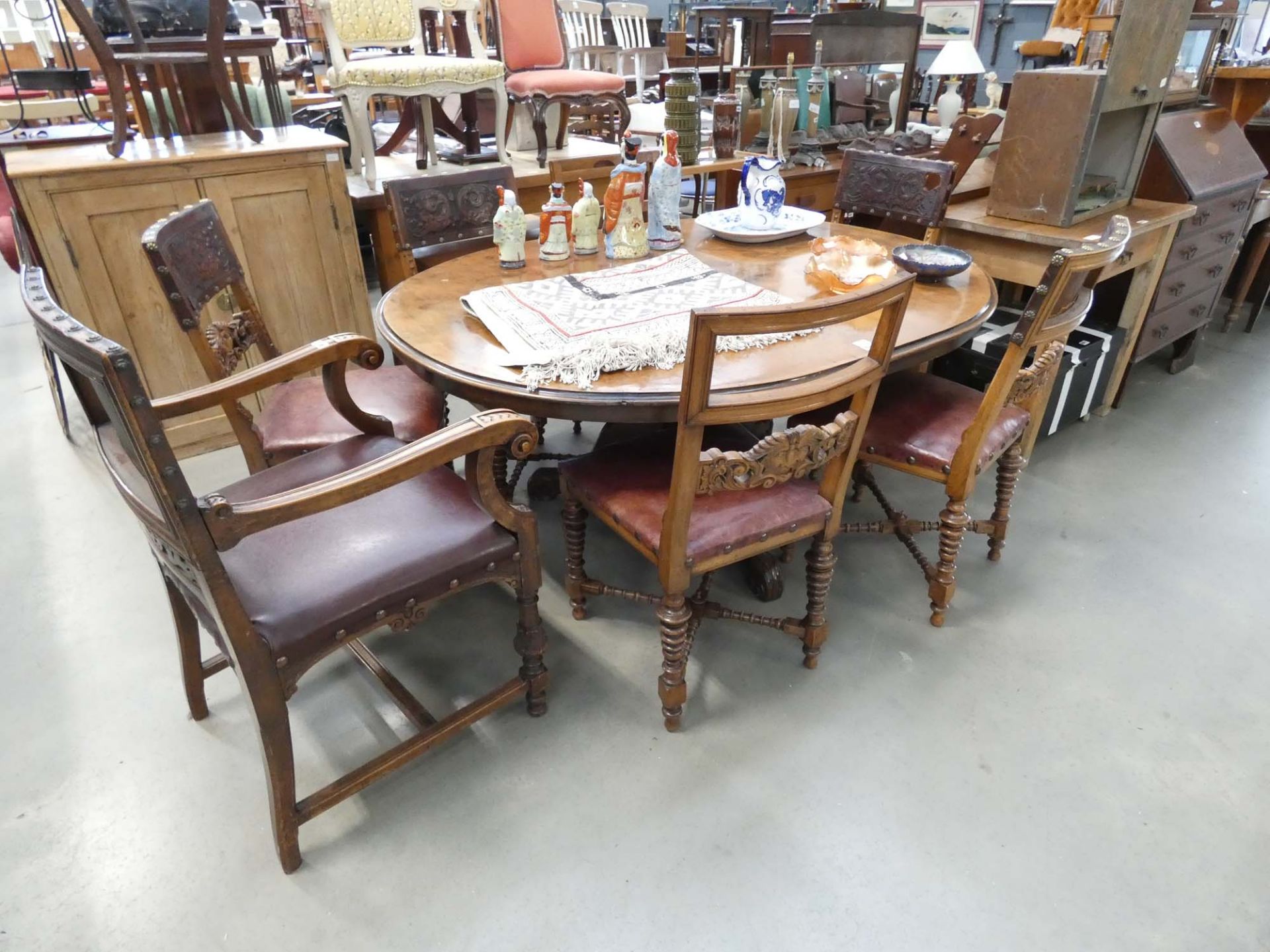 5207 Set of 7 carved oak dining chairs with embossed leather backs (6+1)