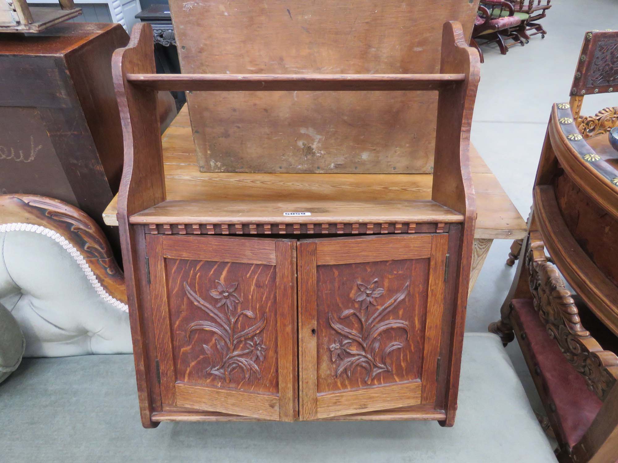 Oak wall mounted cabinet with floral panels