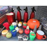 Cage containing soda siphons, kitchen timers and salt and pepper set