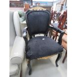 Louis XV style black and gilt armchair