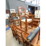 Stained pine extending dining table and 6 chairs