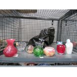 Cage containing quantity of paperweights and tealight holders