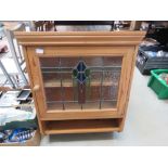 Pine hanging cabinet with glazed and leaded door and shelf under