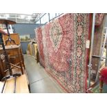 (18) Large red floral carpet with a central medallion
