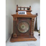 Mantle clock in wooden case