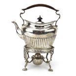 A Victorian silver spirit kettle of typical form with gadrooned decoration on four shell feet,