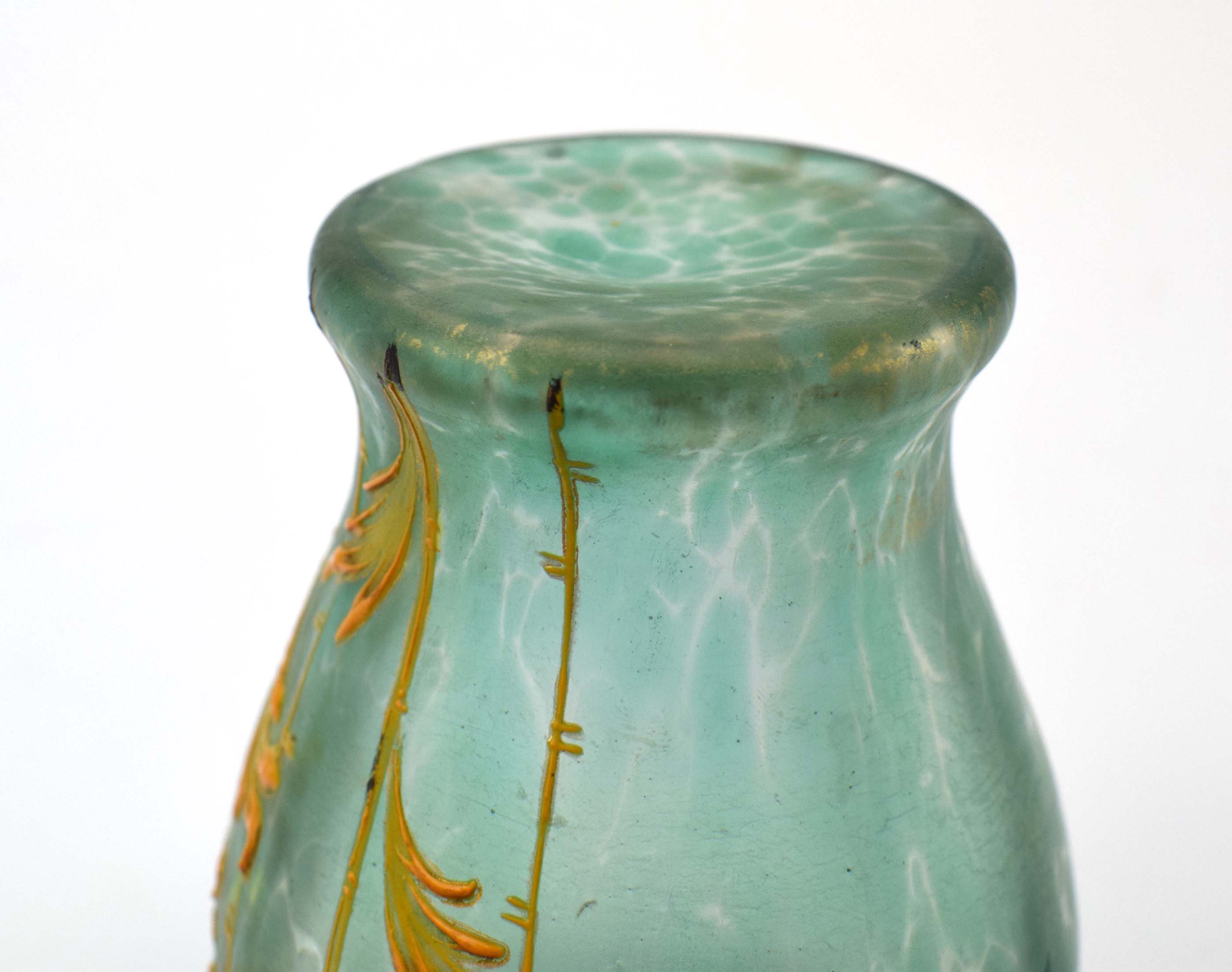 A Loetz type pale green iridescent glass vase of baluster form relief decorated with stylised - Image 3 of 3