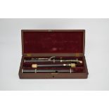 A Keith Prowse three-section flute contained in a mahogany and brass mounted case