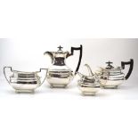 An early 20th century silver four piece tea service of vase shaped form, Walker & Hall,