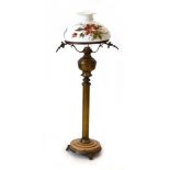 A late 19th century brass oil lamp, the floral hand-decorated opaline glass shade,