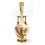 A Royal Worcester ivory blush two handle vase of slender form decorated with flowers in full bloom,