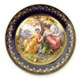 A Vienna porcelain cabinet plate decorated with three classical female musicians, d.