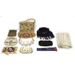 A group of textiles including an embroidered clutch bag with glass roundels,