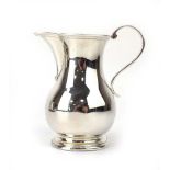 An early 20th century silver cream jug of typical form, maker SI Ltd. Chester 1919, h. 10.5 cm, 3.