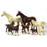 A group of eight Beswick figures, each modelled as a horse including two hunters, various colours,