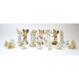 Twenty-one parianware figures, each modelled as a cherub or putti, max h.