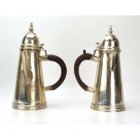 A matched pair of Edwardian Britannia silver hot chocolate and coffee pots of traditional form,